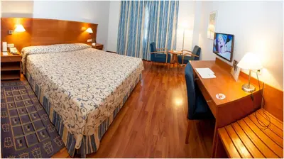 Cama o camas de una habitación en Extremadura Hotel