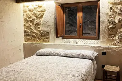 Cama o camas de una habitación en Alojamiento El Olvido en Piedralaves