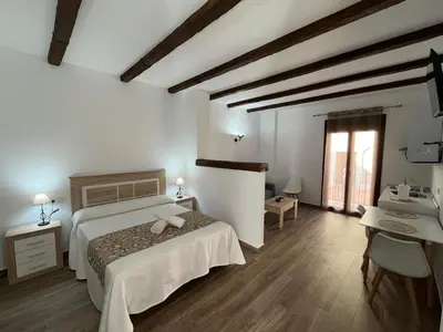 Cama o camas de una habitación en Apartamentos Los Belloso