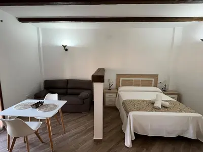 Cama o camas de una habitación en Apartamentos Los Belloso