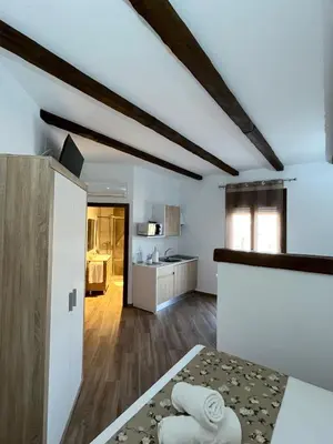 Cama o camas de una habitación en Apartamentos Los Belloso