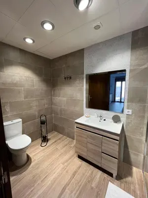 Un baño de Apartamentos Los Belloso