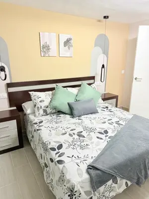 Cama o camas de una habitación en El Boulevard de Trujillo 1997