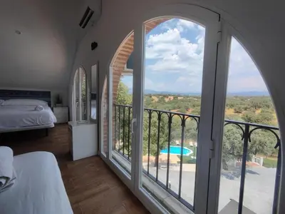 Cama o camas de una habitación en Winahost El Retiro de Toledo