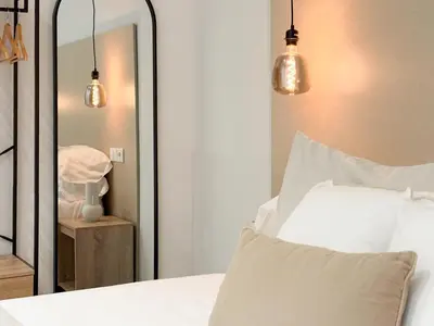Cama o camas de una habitación en TAYP Navalmoral Apartamentos