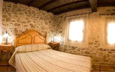 Cama o camas de una habitación en Valle del jerte el huerto del cura