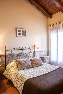 Cama o camas de una habitación en Casas Rurales La Dehesa