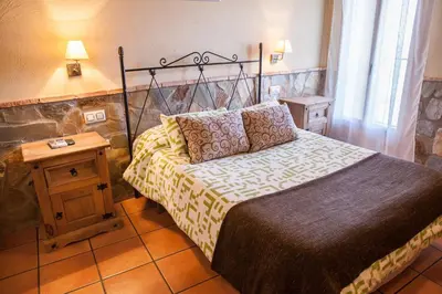 Cama o camas de una habitación en Casas Rurales La Dehesa
