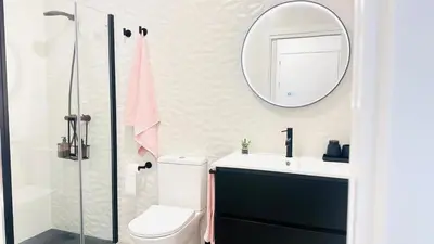 Un baño de Apartamentos la Cárcava