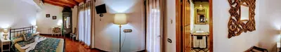 Una televisión o centro de entretenimiento en Casa El Descanso Del Peregrino