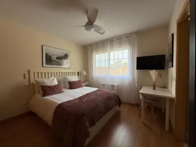 Cama o camas de una habitación en Acogedor chalet con jardín ideal para desconectar