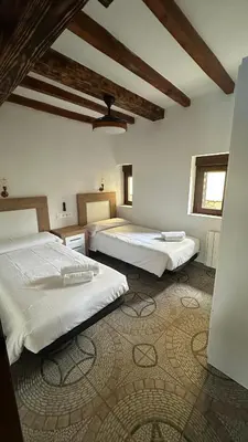 Cama o camas de una habitación en La Casa de los Testarros