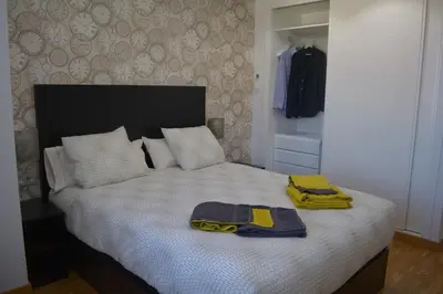 Cama o camas de una habitación en Apartamento Turístico Casa Museo Parking y Cargador
