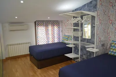 Cama o camas de una habitación en Apartamento Turístico Casa Museo Parking y Cargador