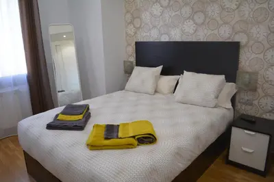 Cama o camas de una habitación en Apartamento Turístico Casa Museo Parking y Cargador