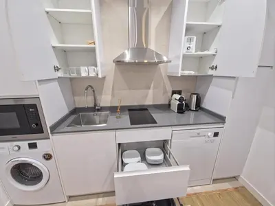 Una cocina o zona de cocina en Apartamentos Picasso by gaiarooms