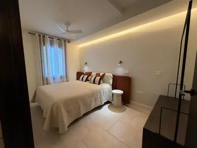 Cama o camas de una habitación en Apartamentos Máximo Parking gratis