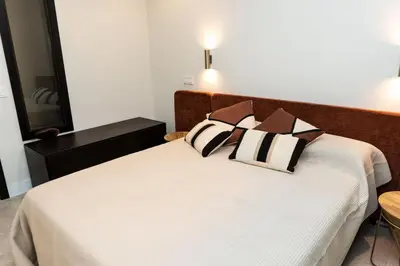 Cama o camas de una habitación en Apartamentos Máximo Parking gratis