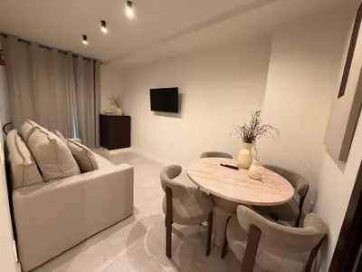 Una televisión o centro de entretenimiento en Apartamentos Máximo Parking gratis