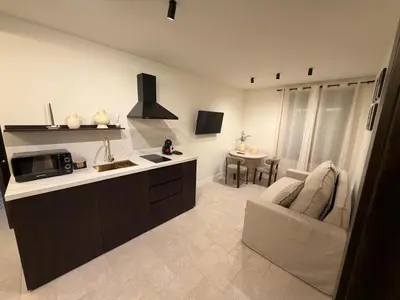 Una cocina o zona de cocina en Apartamentos Máximo Parking gratis