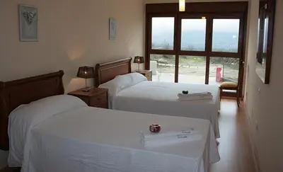 Cama o camas de una habitación en Apartamentos La Covatilla