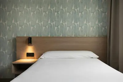 Cama o camas de una habitación en Alora Apartamentos Mérida