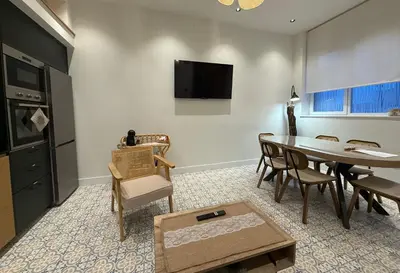 Una televisión o centro de entretenimiento en Alojamiento EL ESPOLON