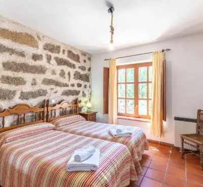 Cama o camas de una habitación en La Bodega de Gredos