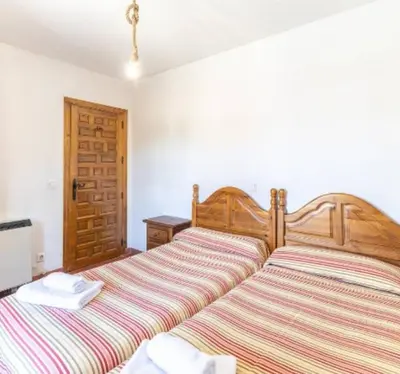 Cama o camas de una habitación en La Bodega de Gredos