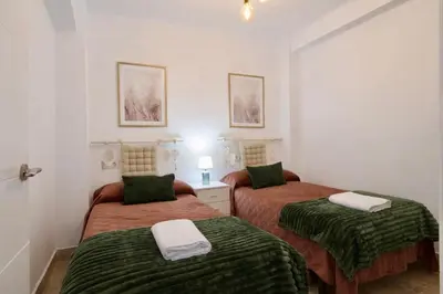 Cama o camas de una habitación en Arenas del Coliseo Centro Parking Gratis
