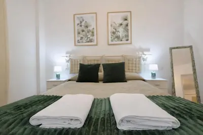 Cama o camas de una habitación en Arenas del Coliseo Centro Parking Gratis