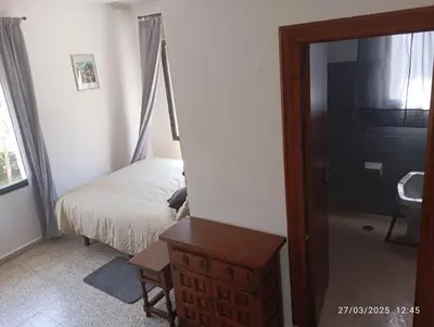 Cama o camas de una habitación en Hostal Prados Abiertos