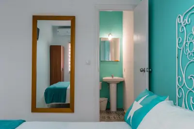 Cama o camas de una habitación en Hostal Imperial centro de Mérida