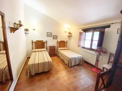 Cama o camas de una habitación en Virgen de la Cabeza Rural House