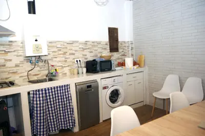 Una cocina o zona de cocina en Acogedora casita con barbacoa