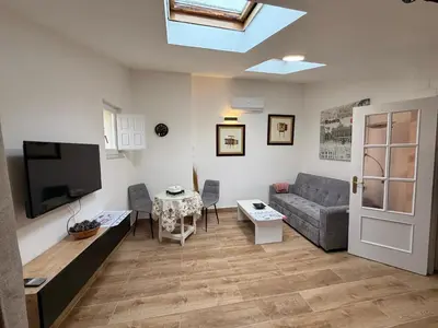 Una televisión o centro de entretenimiento en Casa De Los Aguilas
