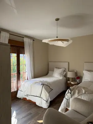 Cama o camas de una habitación en El Corral de Tía Gloria