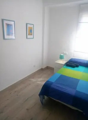 Cama o camas de una habitación en Apartamento de 2 dormitorios a 5 minutos de la plaza mayor