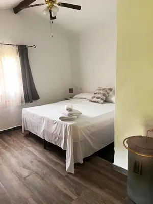 Cama o camas de una habitación en Casa de la luz-Finca la sierra Alojamiento de 4 estrellas completo en el corazón del Geoparque de 6 a 12 personas