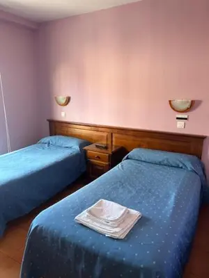 Cama o camas de una habitación en Hotel Cadalso - Casa Moncho