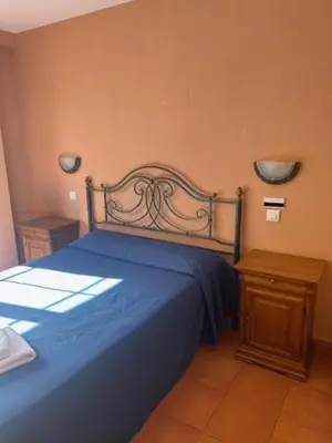 Cama o camas de una habitación en Hotel Cadalso - Casa Moncho
