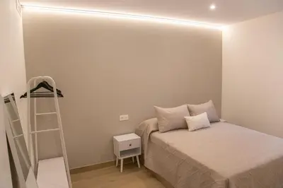 Cama o camas de una habitación en Apartamentos ÍCARO