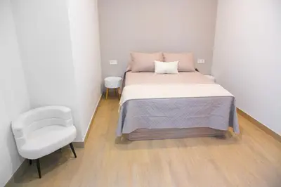 Cama o camas de una habitación en Apartamentos ÍCARO