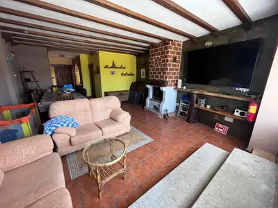 Una televisión o centro de entretenimiento en Casa rural el pozo
