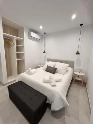 Cama o camas de una habitación en One Apartamentos