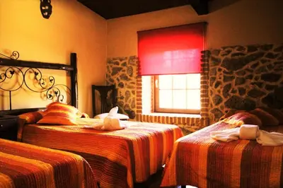 Cama o camas de una habitación en Hotel Rural Vistahermosa
