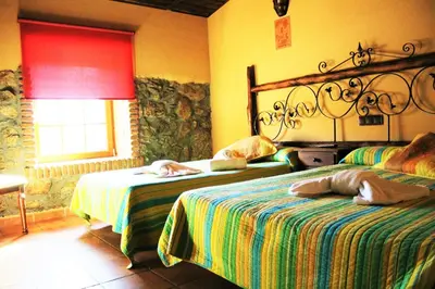 Cama o camas de una habitación en Hotel Rural Vistahermosa