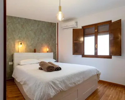Cama o camas de una habitación en Amplio Apartamento Avenida Alfonso VIII Plasencia