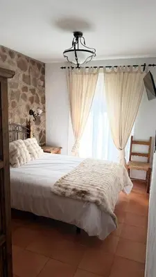 Cama o camas de una habitación en Hotel Rural La Posada de Lía