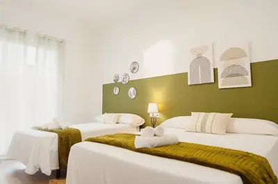 Cama o camas de una habitación en AT Macias Home centro Cáceres
